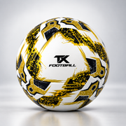 A Hybrid soccer ball with a black and gold geometric pattern and the TX FOOTBALL logo in the center, set against a light gray studio background.